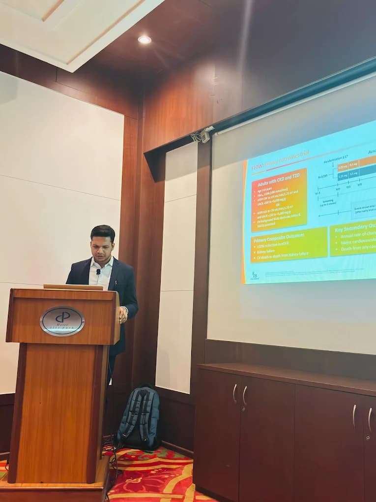 Dr. Pawan Goel presenting clinical trial data at a conference