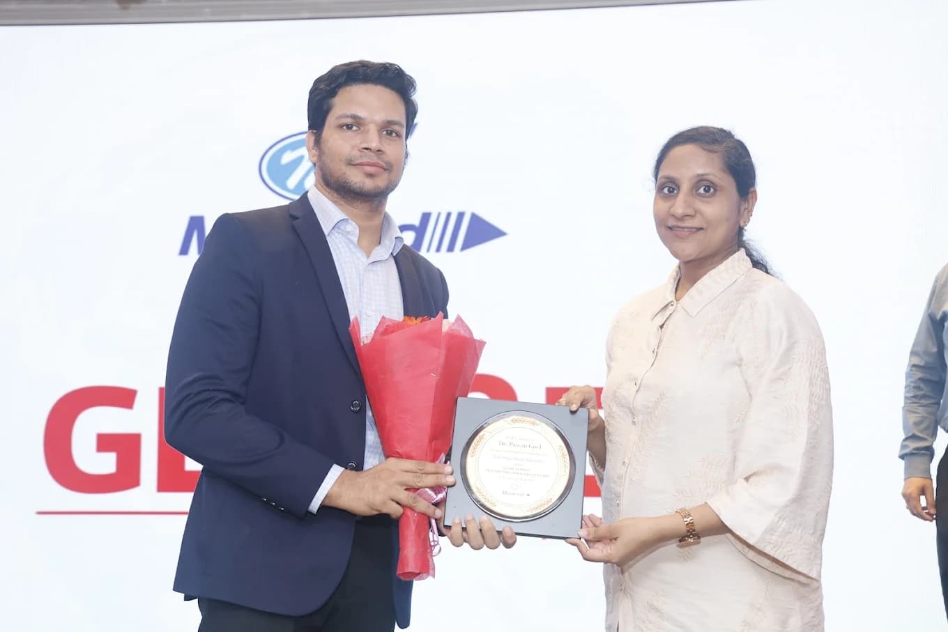 Dr. Pawan Goel being felicitated at a medical event